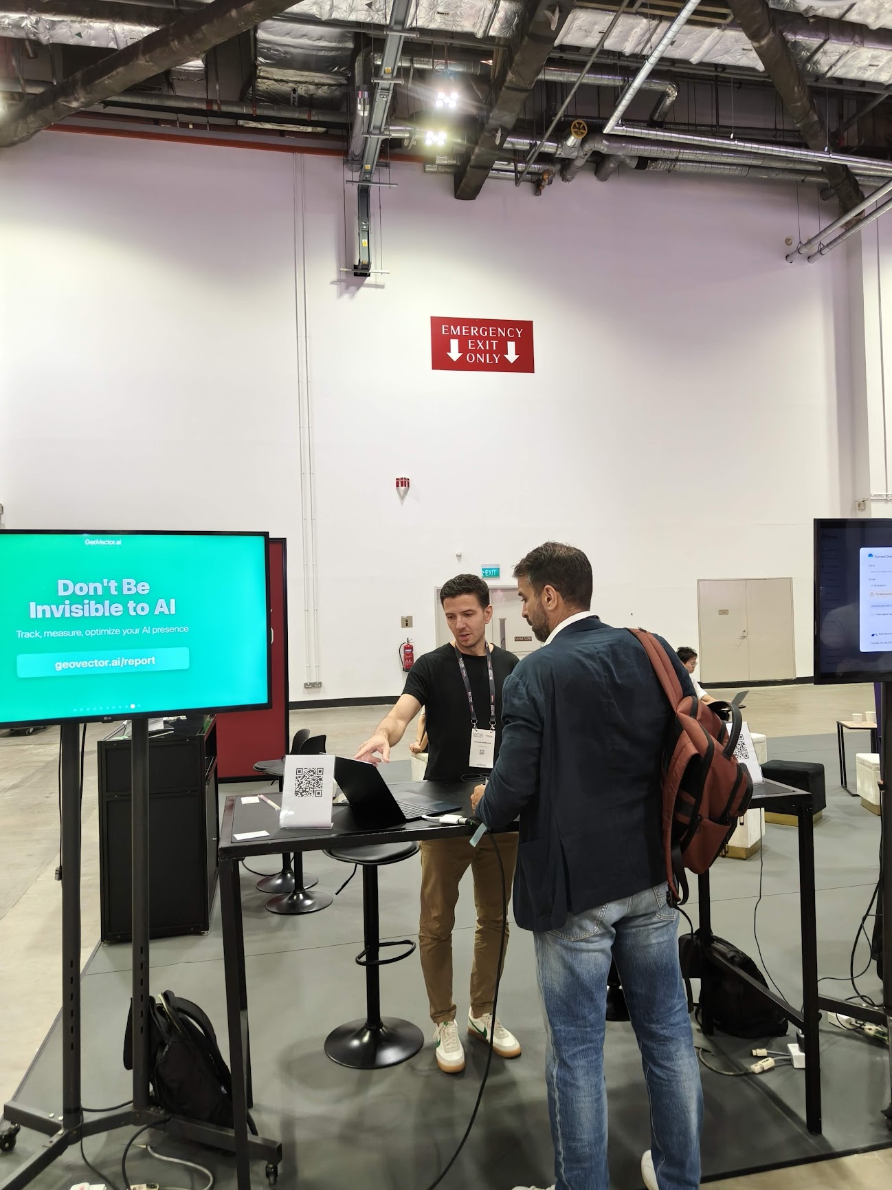 Team member engaging with visitors at SWITCH 2025